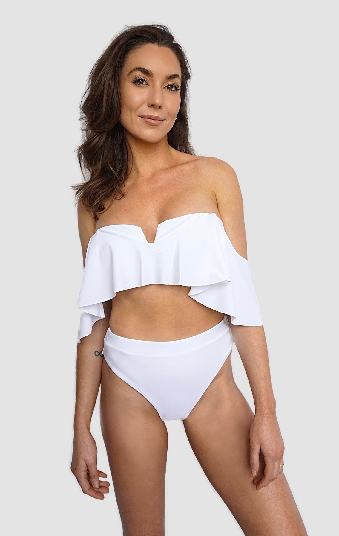 Carling Liski wears Canadian swimwear brand Prairie Swim white fluttery strapless bikini top